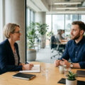 Departing employee answering exit interview questions with an HR representative